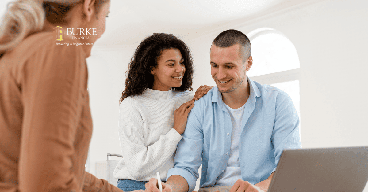 Mortgage broker shaking hands with a homeowner while handing over a set of keys, symbolizing negotiated rates and personalized investment strategies