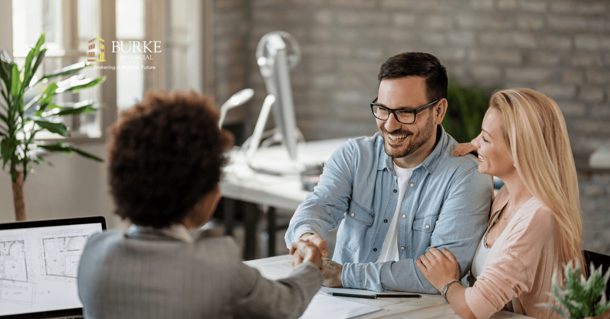 Mortgage broker showing approval options to Barrie homeowner