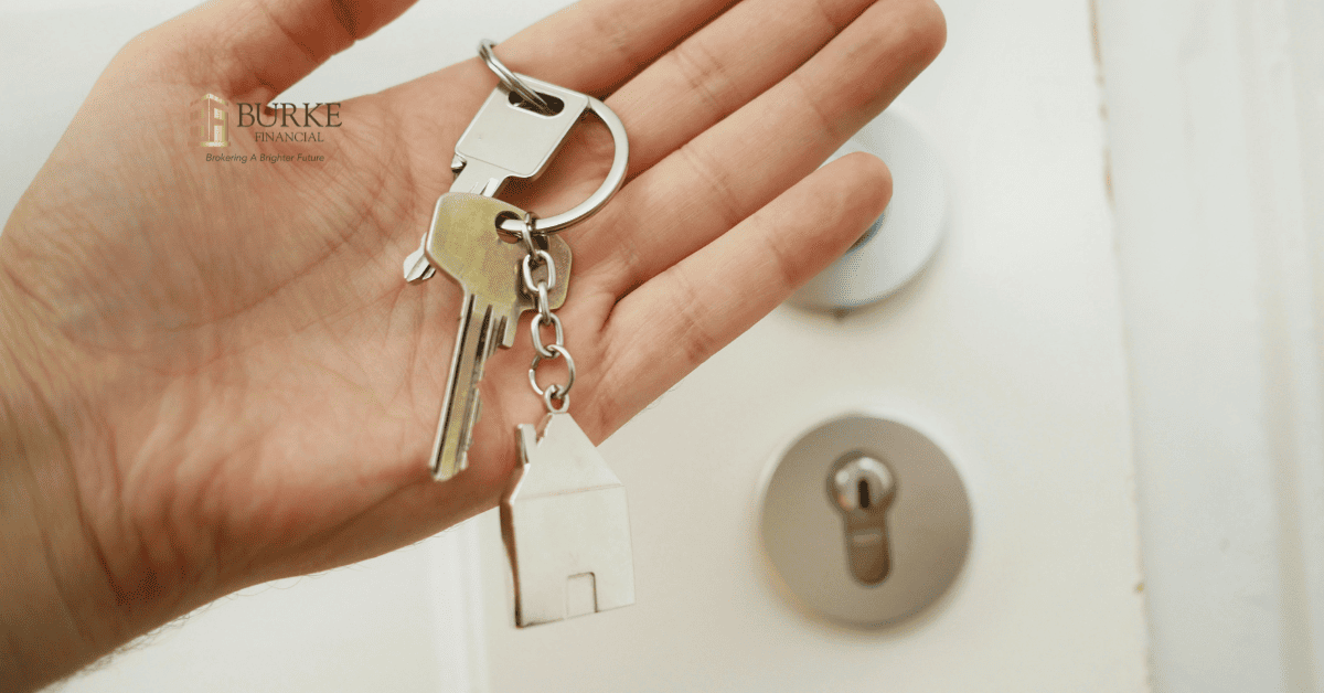 House keys in a homeowner's hand representing home equity and reverse mortgage opportunities for seniors in Ontario.